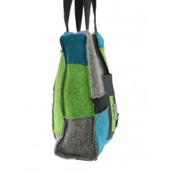 A patchwork shoulder bag made of small colored pieces of steamed wool and linen