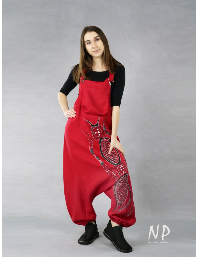 Red dungarees with lowered crotch made of natural linen.