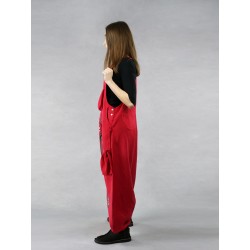 Red dungarees with lowered crotch made of natural linen.