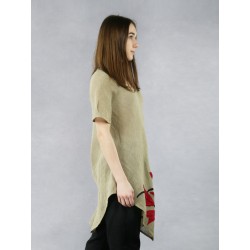 A linen twill blouse with an asymmetrical hem and sewn-on flowers.