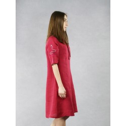 Short, maroon linen dress with decorative colored stitching