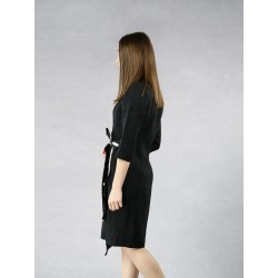 Black dress with a zipper tied on the side of a shirtdress.