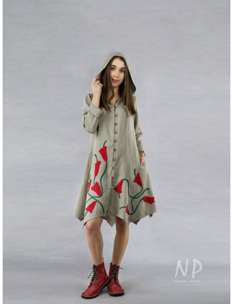 A buttoned linen coat dress with a hood, decorated with sewn-on flowers