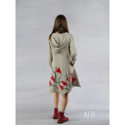A buttoned linen coat dress with a hood, decorated with sewn-on flowers