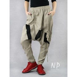 Linen trousers with a lowered crotch and tapered legs