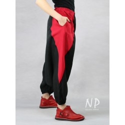 Black linen pants with a lowered crotch finished with an elastic band