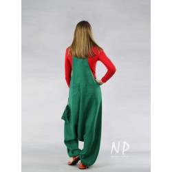 Green dungarees with a lowered crotch made of natural linen.
