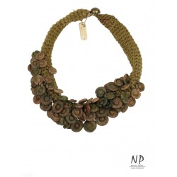 Gold-tone handmade necklace made of linen threads and ceramic ornaments