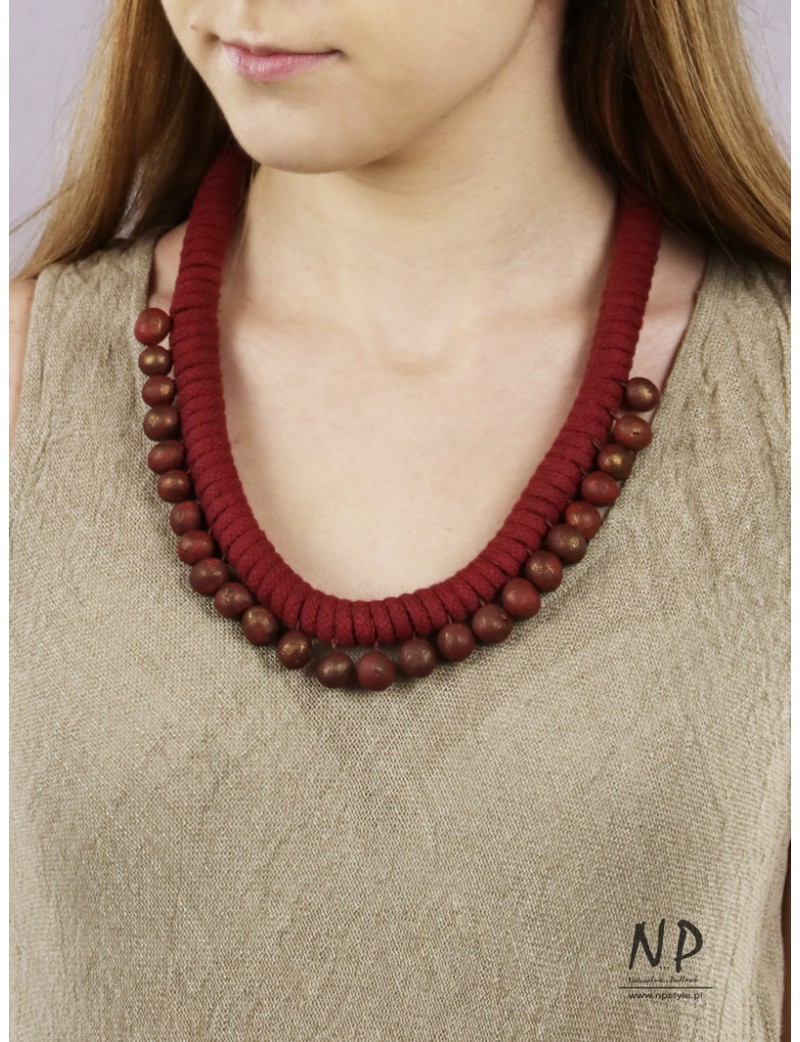 Handmade necklace made of cotton string, decorated with ceramic beads