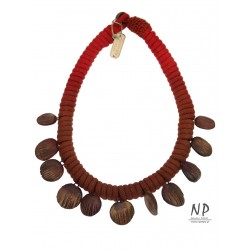 Handmade necklace made of cotton string, decorated with flat clay beads
