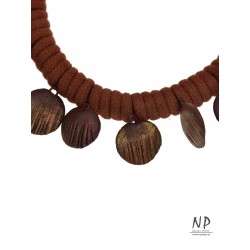 Handmade necklace made of cotton string, decorated with flat clay beads