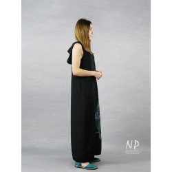 Black linen dress with a hood decorated with a hand-painted face in contrasting colors