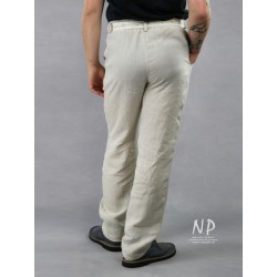 Męskie spodnie lniane z paskiem na gumie oraz imitacją rozporka.