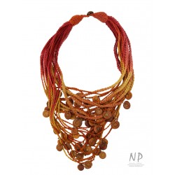 Handmade colorful necklace, made of braided strings, decorated with ceramic beads