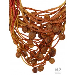 Handmade colorful necklace, made of braided strings, decorated with ceramic beads