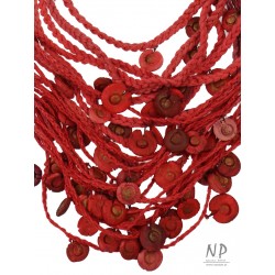 Handmade red necklace, made of braided strings, decorated with ceramic beads