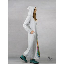 Long, light gray knitted turtleneck dress decorated with a hand-painted saxophone