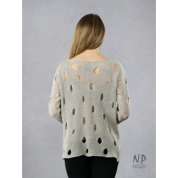 A linen sweater with holes for women in the color of natural linen.