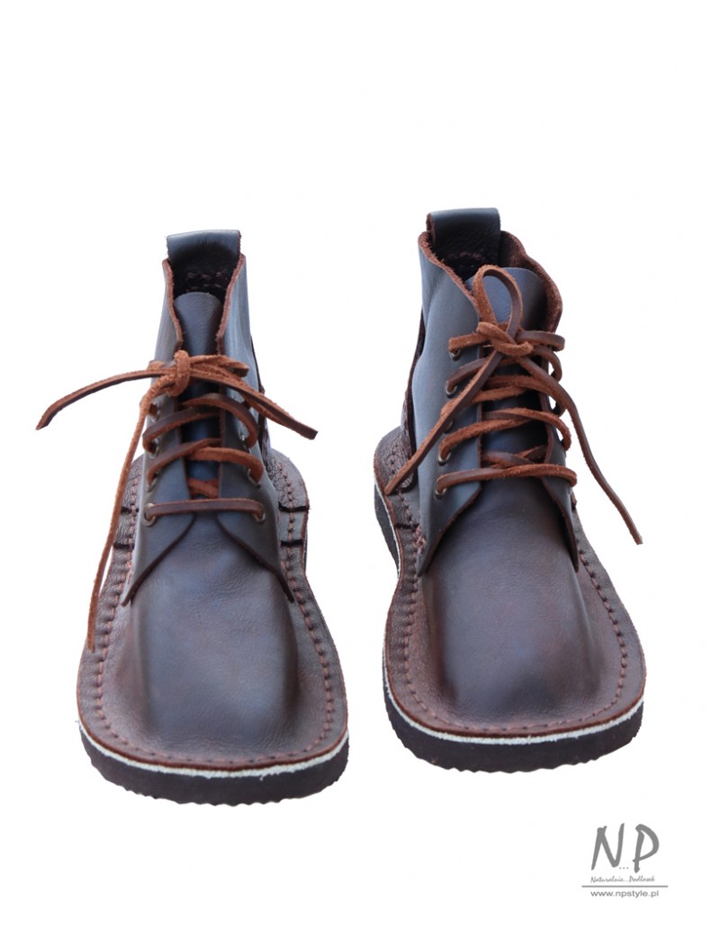 Brown, handmade leather Basic 5 hiking boots, laced with a strap.