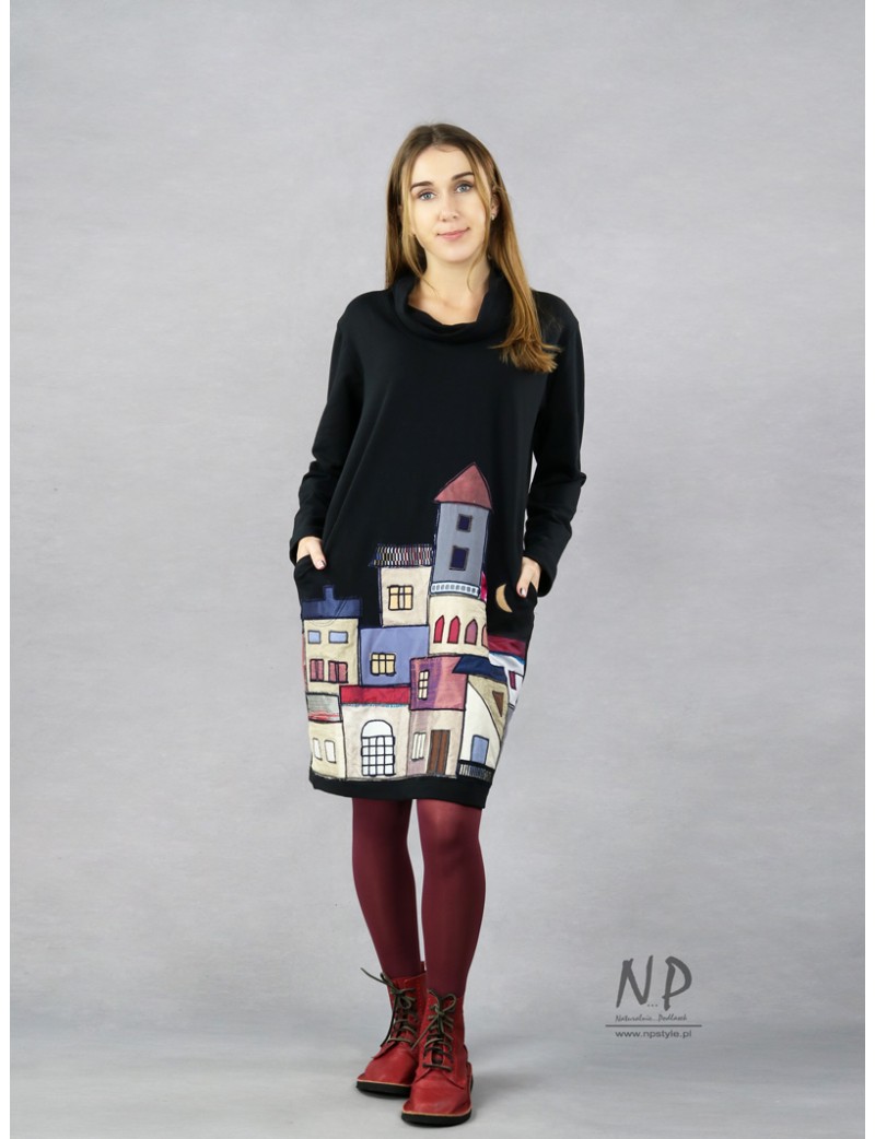 Short, knitted black dress with a loose turtleneck, decorated with hand-sewn houses