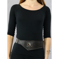 A wide decorative brown leather belt for the dress