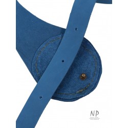 A wide decorative blue leather belt for the dress