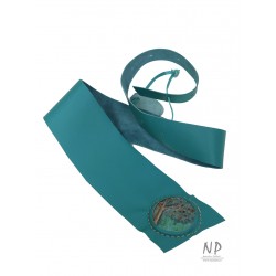 A wide turquoise leather belt for the dress, decorated with ceramics