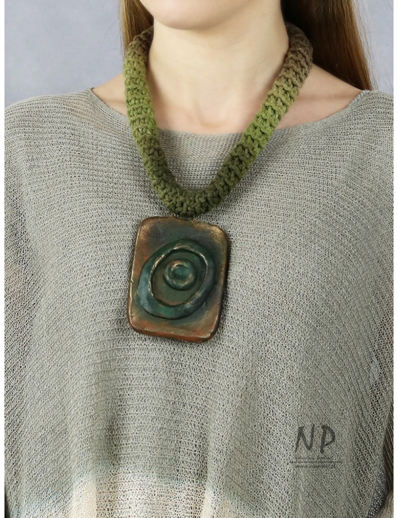 Necklace with ceramics on a braided string