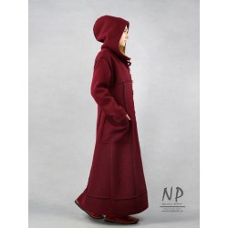 Long, maroon oversized winter coat with a hood, made of warm steamed wool