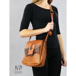 Hand-sewn medium-sized leather handbag with a decorative flap