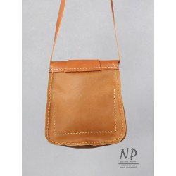 Hand-sewn medium-sized leather handbag with a decorative flap