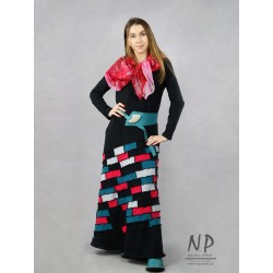 Black maxi knitted dress, decorated with small pieces of fabric in the form of patchwork