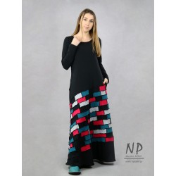 Black maxi knitted dress, decorated with small pieces of fabric in the form of patchwork