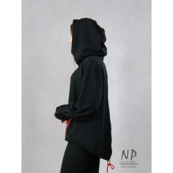Black knitted sweatshirt with a longer back, large hood and wide sleeves