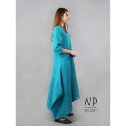 Turquoise linen maxi dress with a sleeve by the elbow, pockets and a triangular neckline