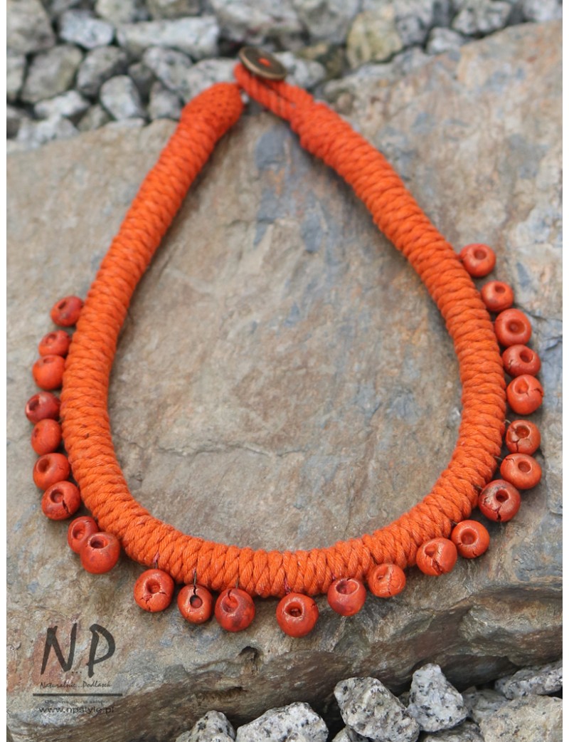 Women's necklace made of orange cotton string, decorated with hand-made ceramics
