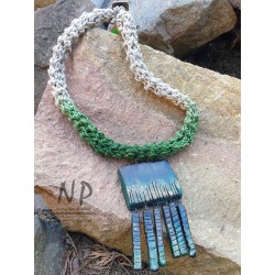 Necklace made of linen braided threads decorated with ceramics