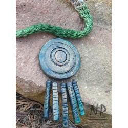 A dyed linen thread necklace decorated with original ceramics
