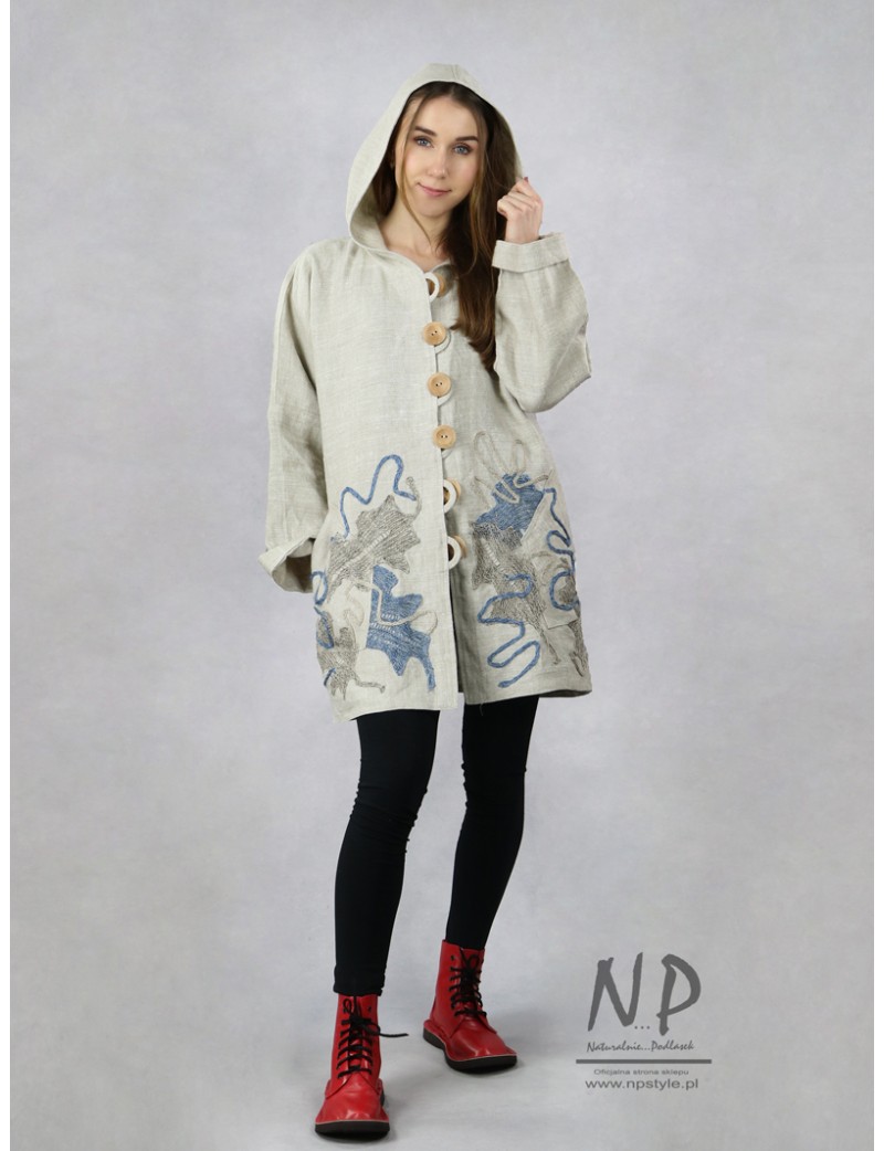 Oversized linen jacket with a hood and decorated with hand-sewn fabrics