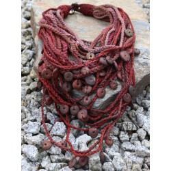 Braided necklace decorated with handmade ceramic beads