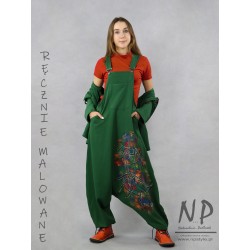 Green dungarees decorated with hand-painted patterns