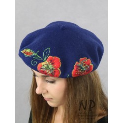 Wool women's beret decorated with embroidered applications