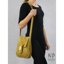 Honey women's handbag made of natural leather with a decorative flap