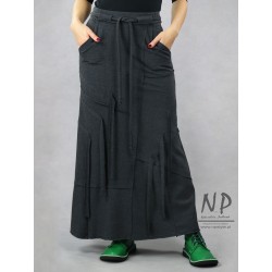Long, knitted gray narrow skirt decorated with sewn-on stripes
