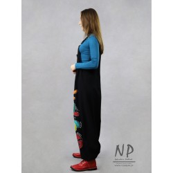 Black dungarees decorated with hand-painted patterns