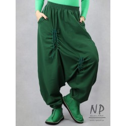 Green pants with a low crotch and an elastic waistband