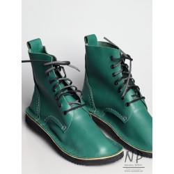 Green, hand-sewn leather Basic 7 hiking boots, laced with a strap