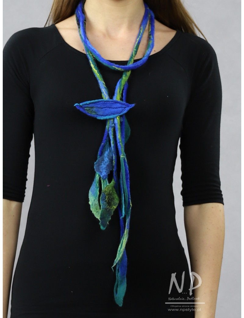 Long felt necklace made in the form of a twig with blue flowers and attached brooch