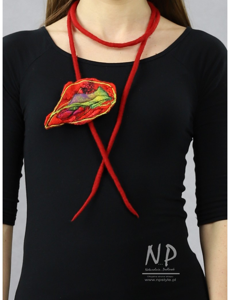 A long necklace made in the form of a felted cord with an additional embroidered brooch