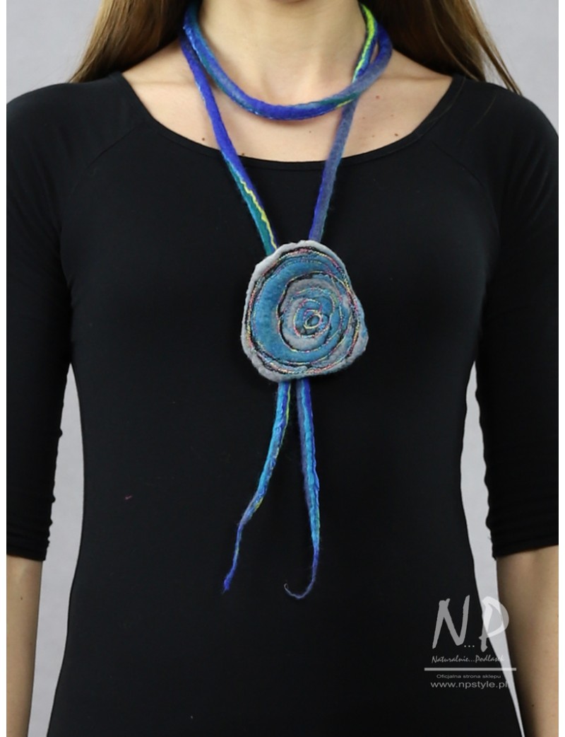 A long necklace made in the form of a felted cord with an additional embroidered brooch